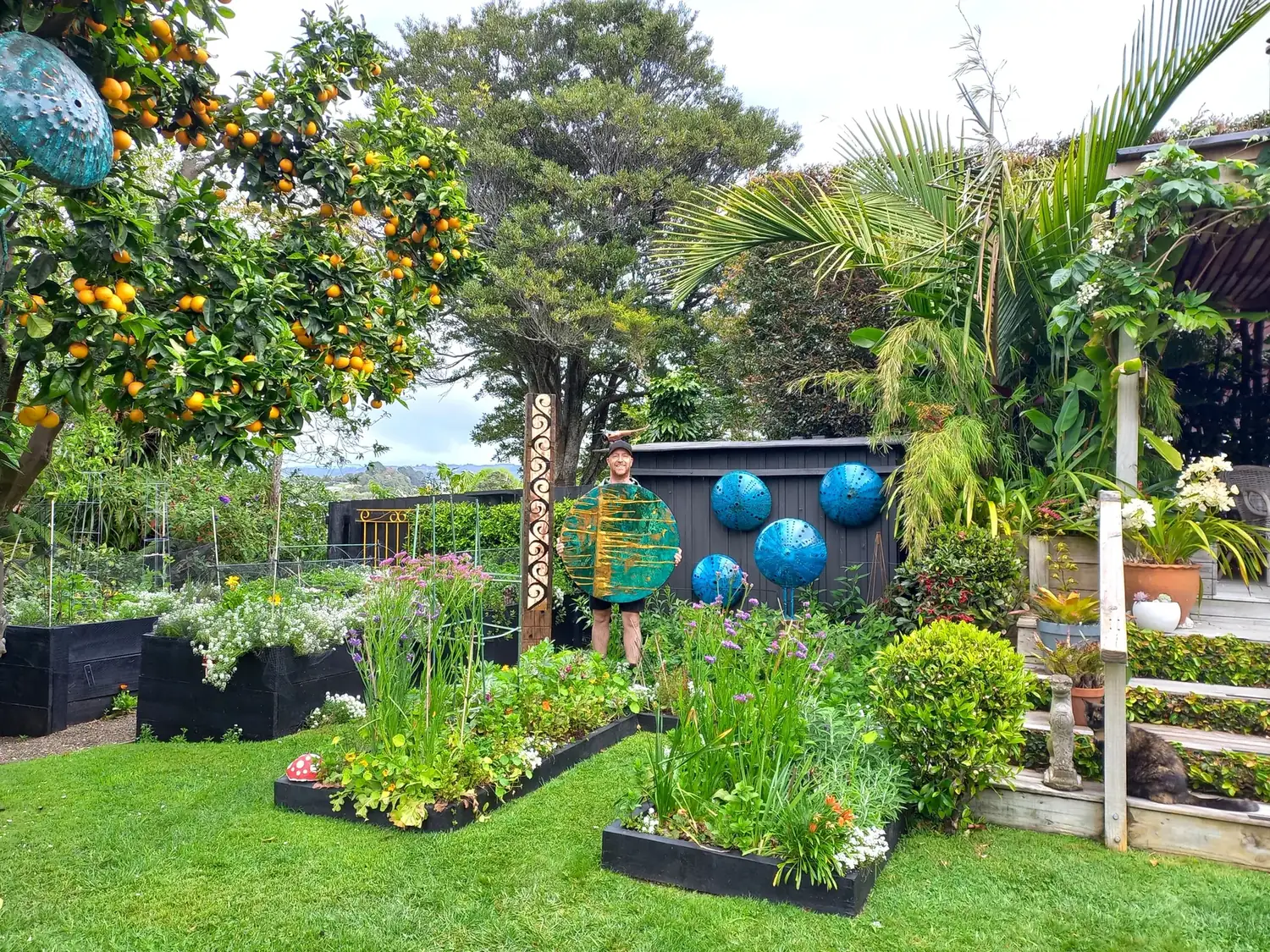 The sculpture garden at Isaac Weston’s Matua property, planted beds and copper totems